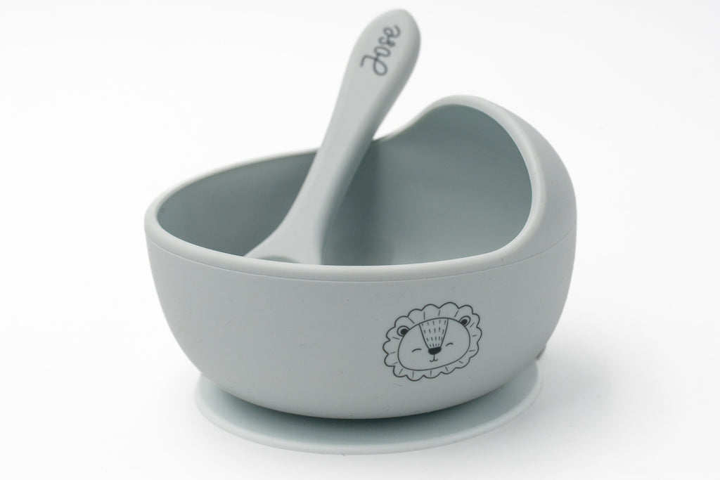 Grey bowl with a lion and spoon with a name