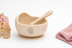 Beige bowl with a lion and spoon with a name