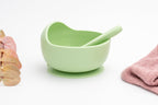 Light green silicone bowl with suction base and matching spoon