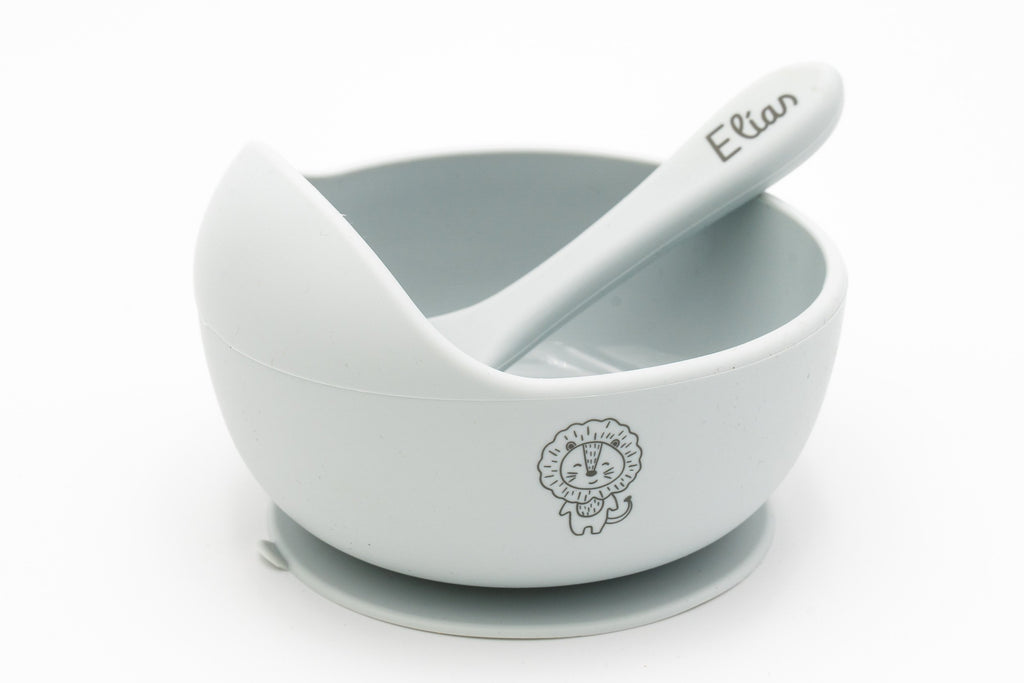 Grey bowl with a lion and spoon with a name