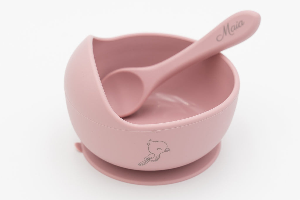 Pink bowl with a bird and spoon with a name