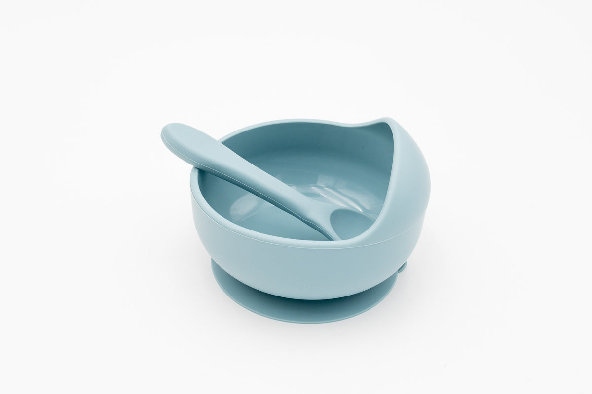 Blue silicone bowl with suction base and matching spoon