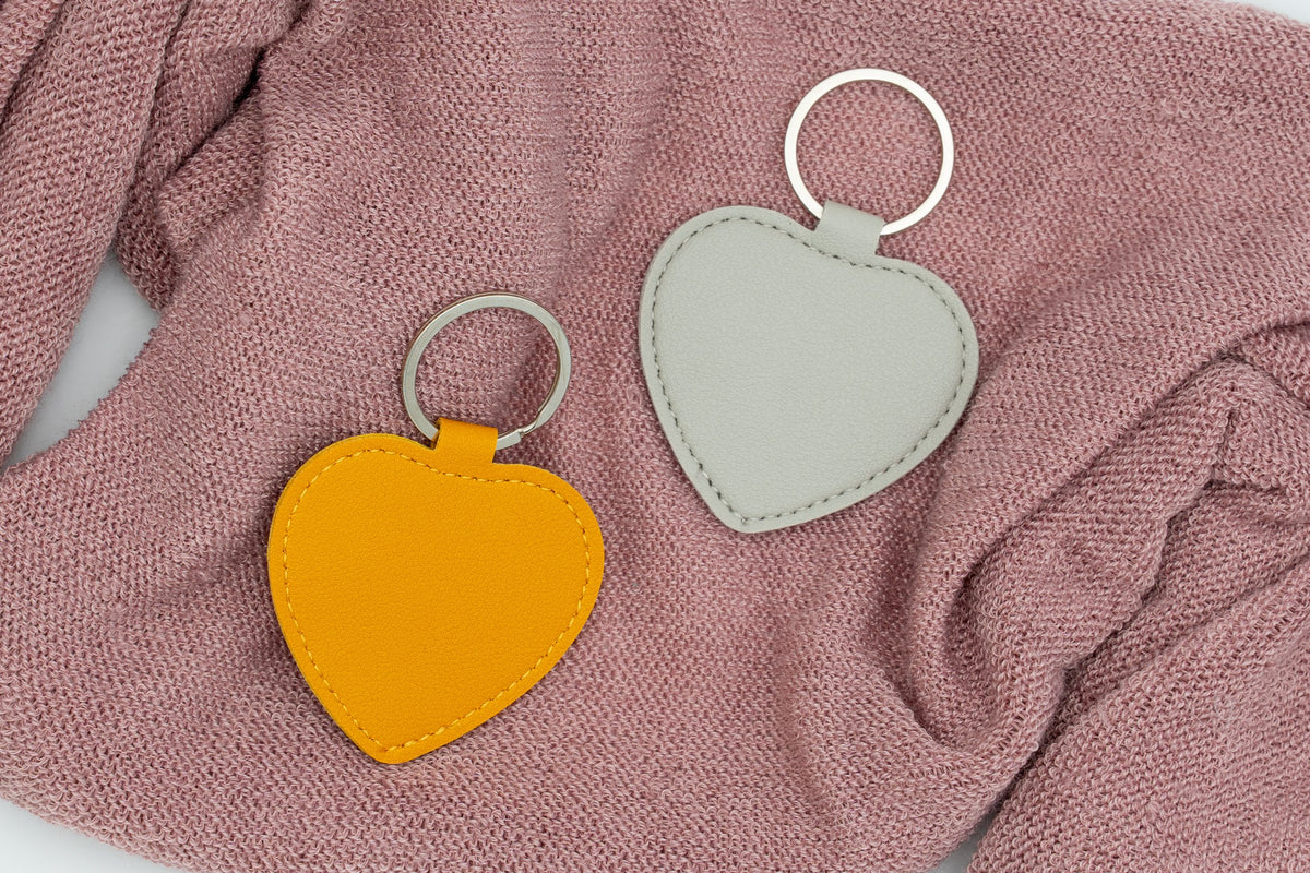 Warm-toned and grey heart keyrings without personalisation.