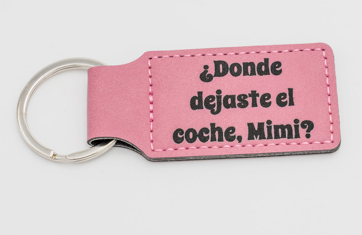 Pink rectangular keyring with a question about the car keys.
