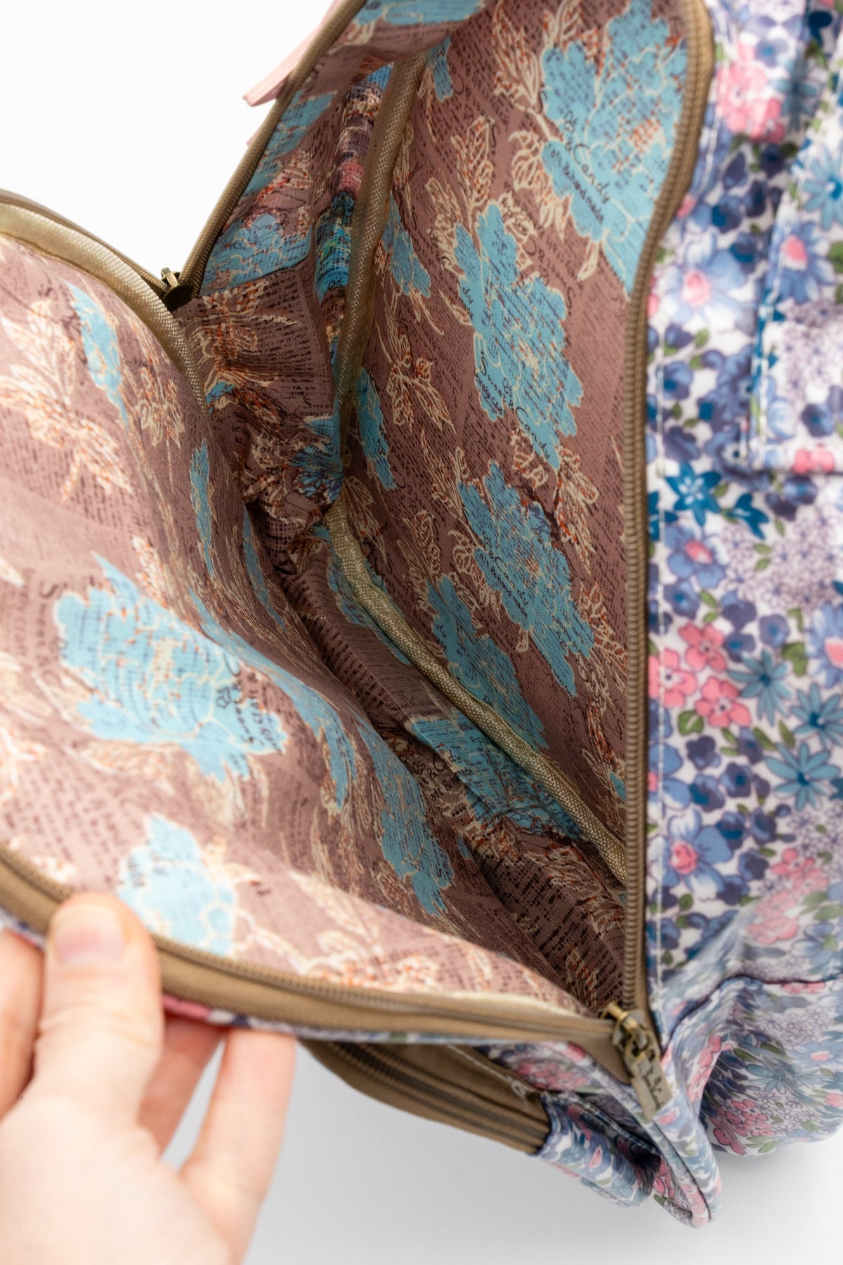 Inside the backpack's main compartment with map-print lining