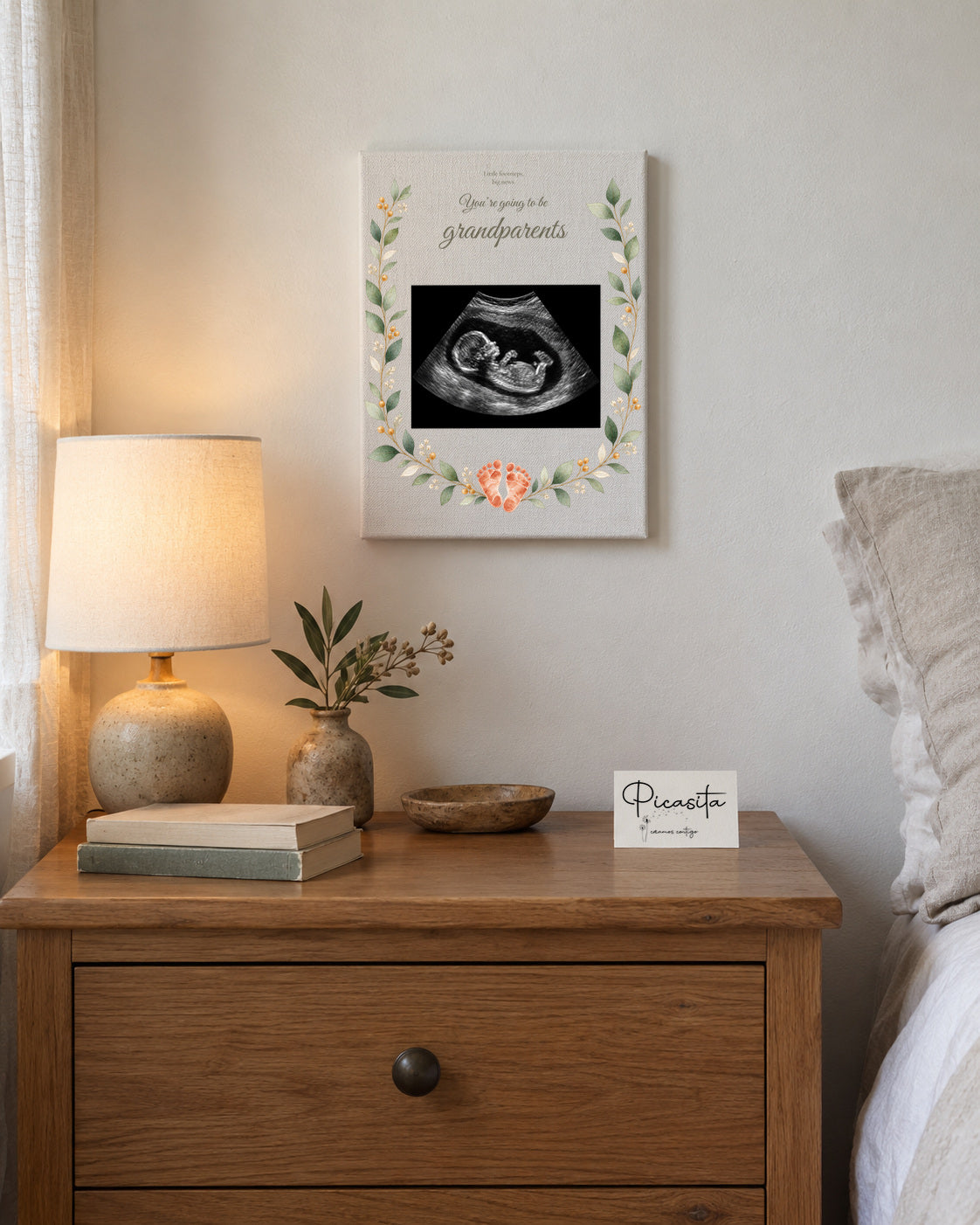 Simulated preview: Little footprints on Canvas, 15 × 20 cm, with an illustrative synthetic ultrasound. Wall scene.