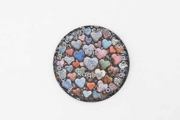 Round slate coaster with colourful hearts and personalised names.