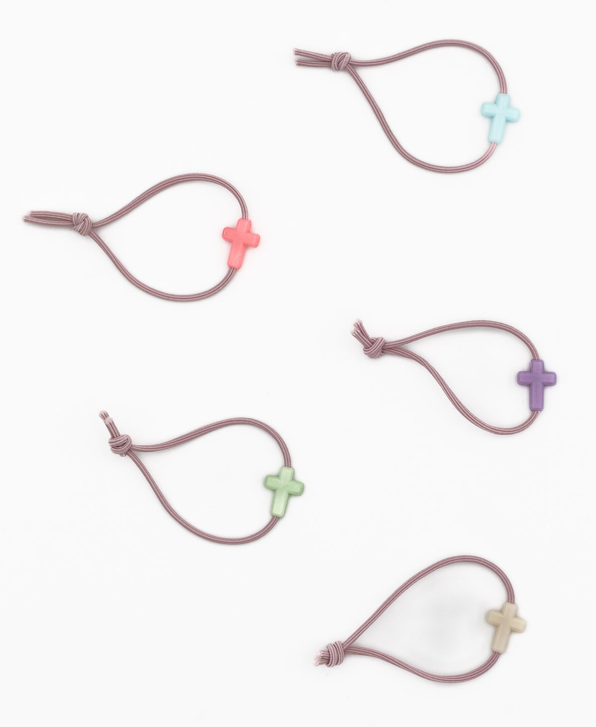 Five elastic mauve bracelets with silicone cross motifs in various shades
