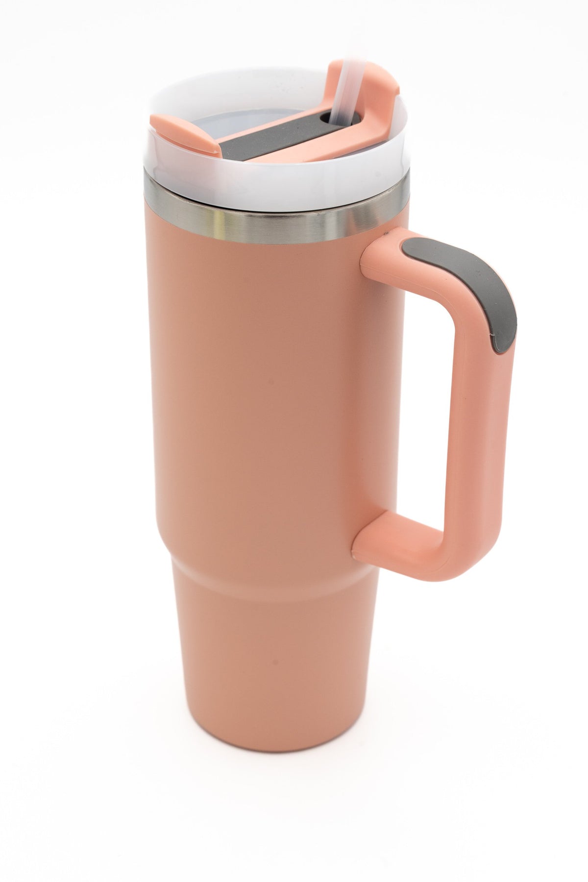 Salmon travel tumbler with a handle and dark grey detail on the lid