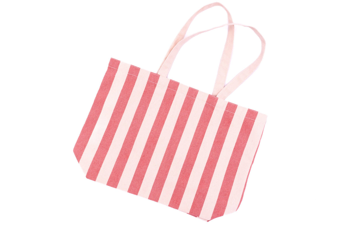 Wide view of a cotton beach bag with pink and white stripes