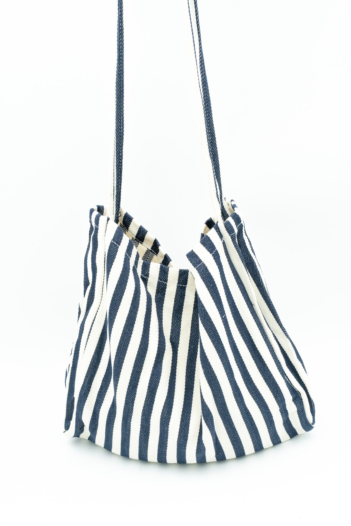 Side view of a cotton bag with navy and white stripes