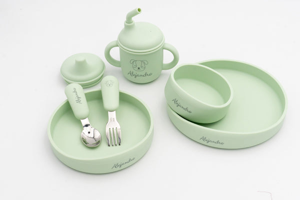 Light green baby tableware with three plates, spoon, fork and 3-in-1 cup with the name engraved