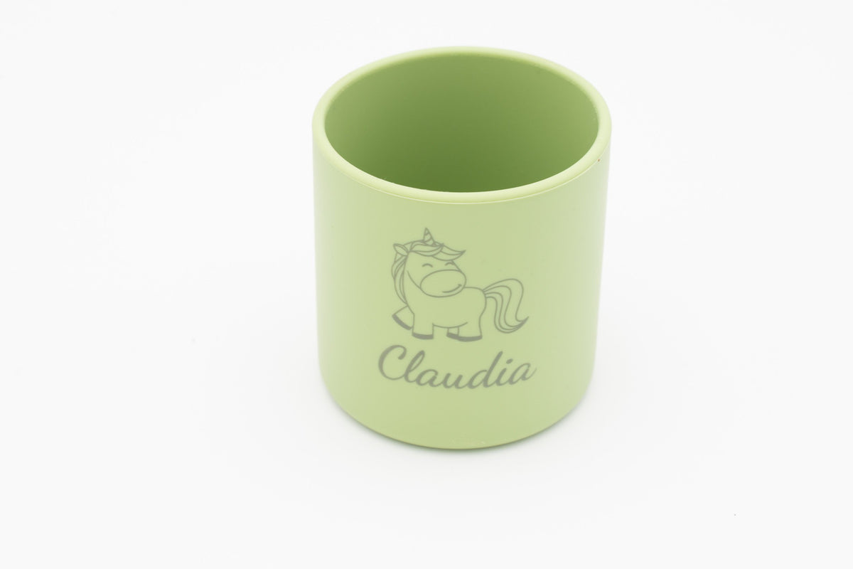 Front view of a light green silicone children's cup